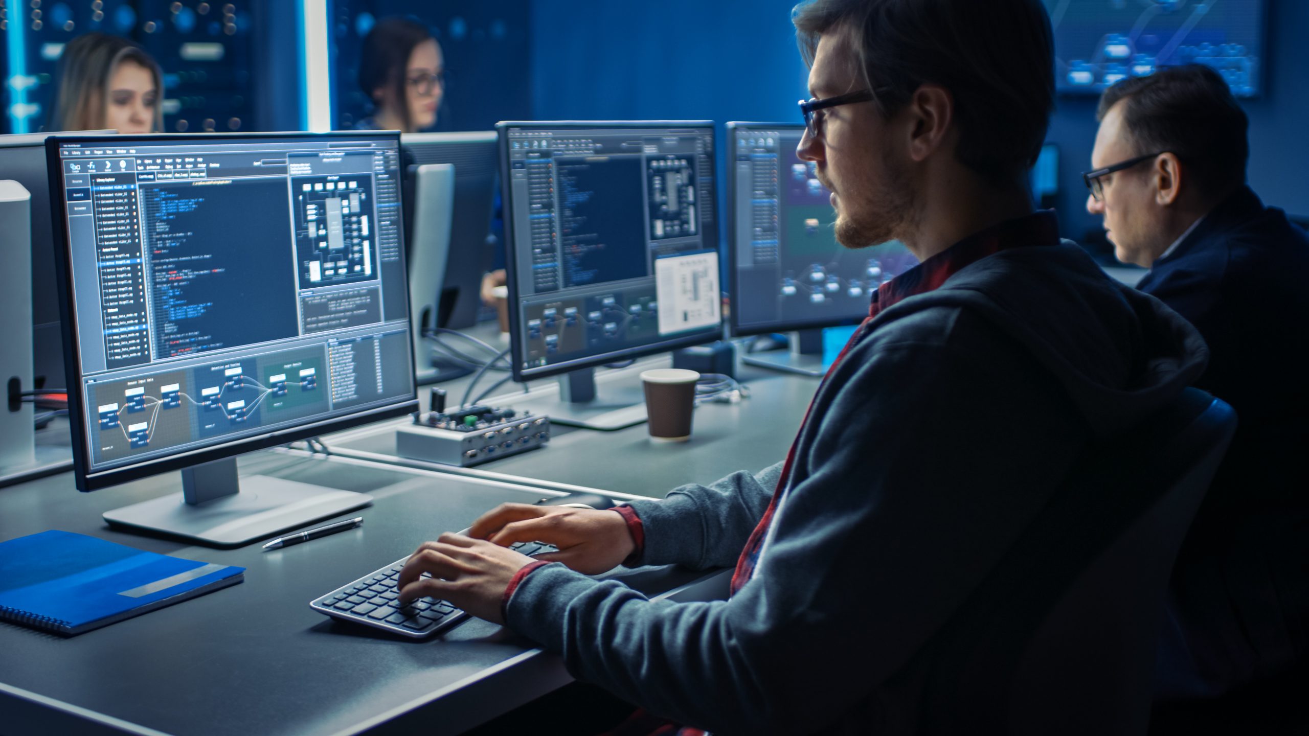 Smart Male IT Programer Working on Desktop Green Mock-up Screen